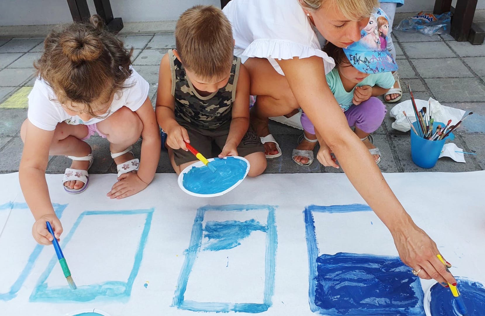 Colorlab focusing on water tones, kids creating the shades of blue
